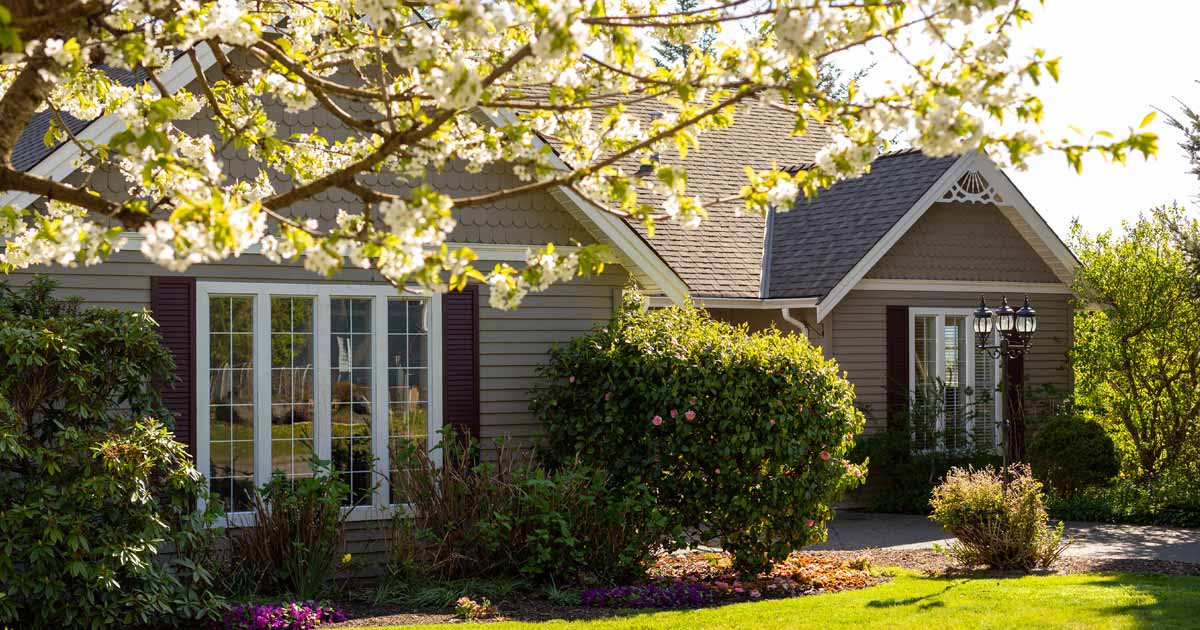 house with flowers blooming in spring time